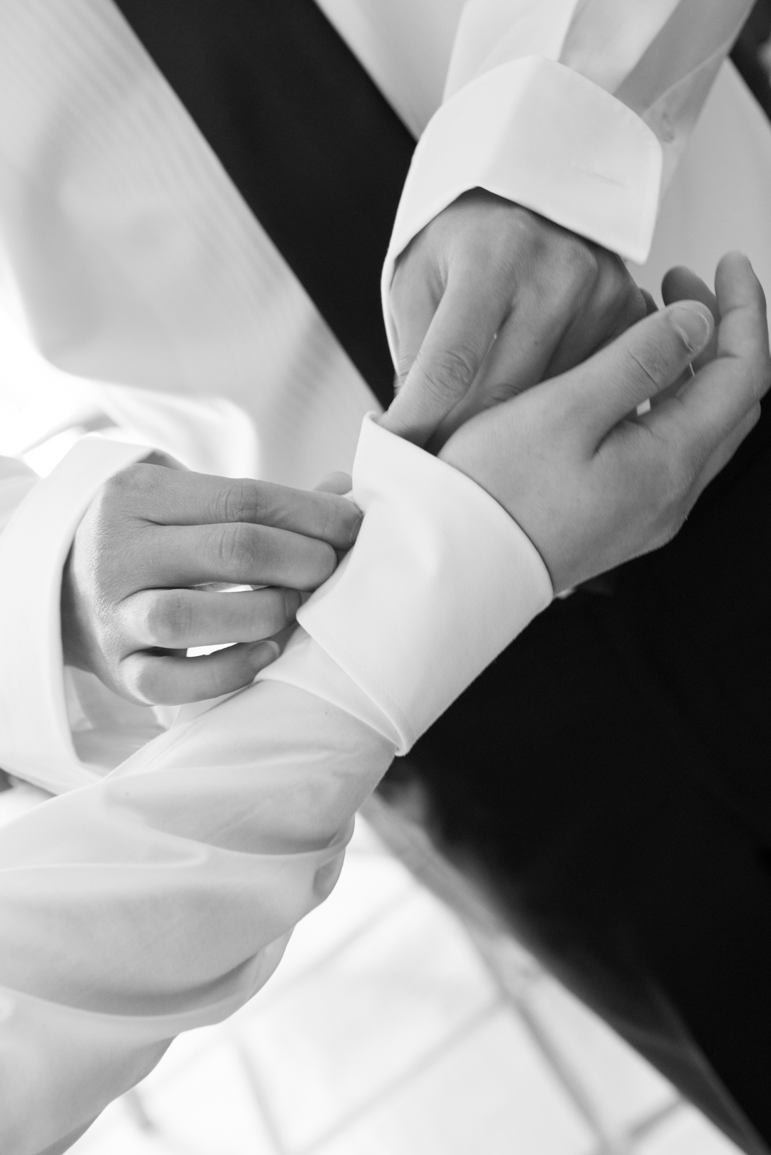 Close up of groom's cufflinks put on