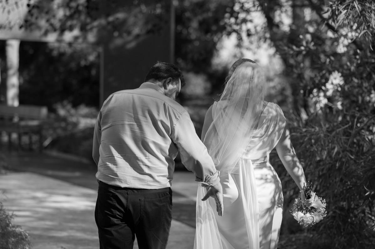 Groom helping bride's veil in King's Park