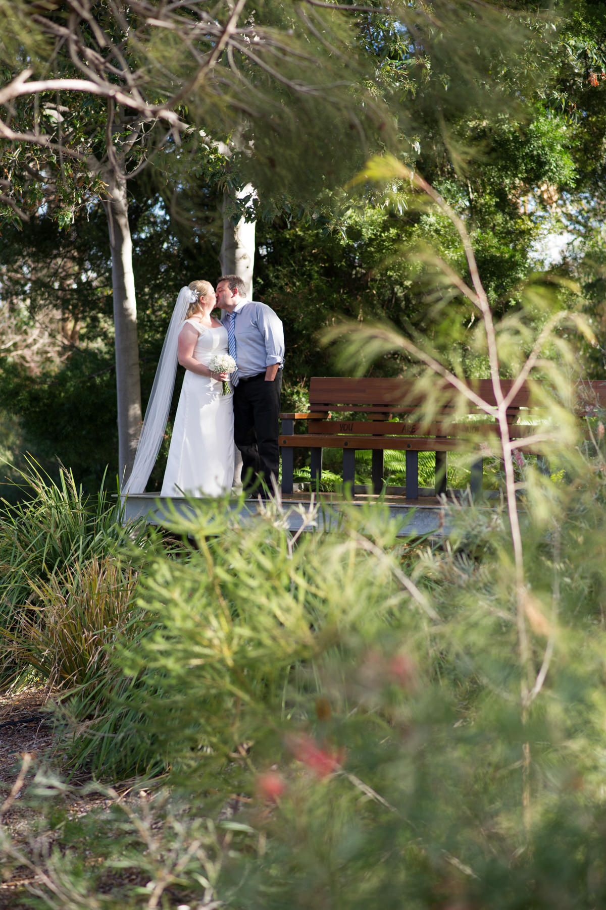 Bride and groom kissing in King's Park