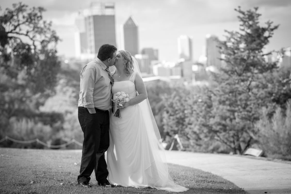 Black and white bridal portrait with Perth city behind