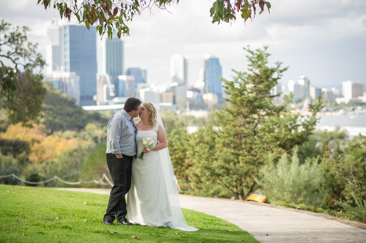 Bride and groom kissing in King's park, Perth