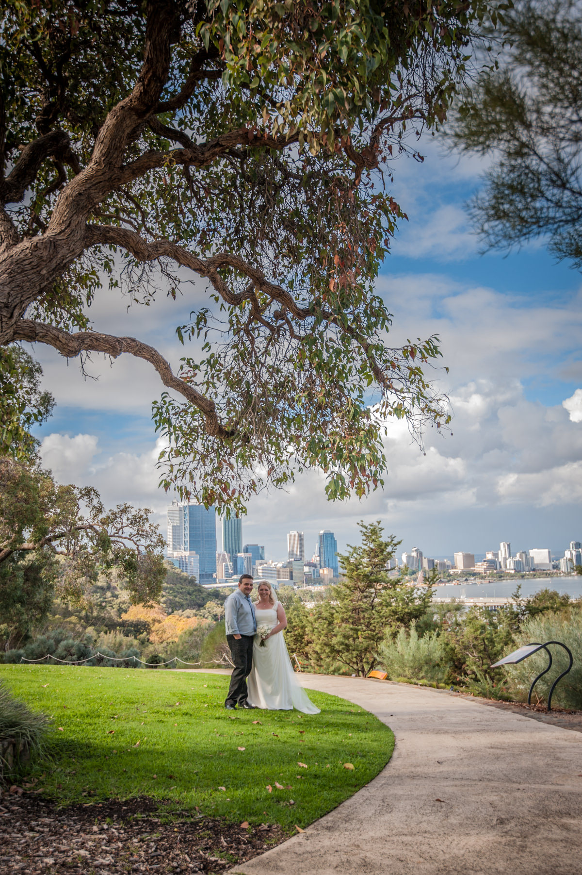 Bride and groom with Perth city in background at King's Park, Perth