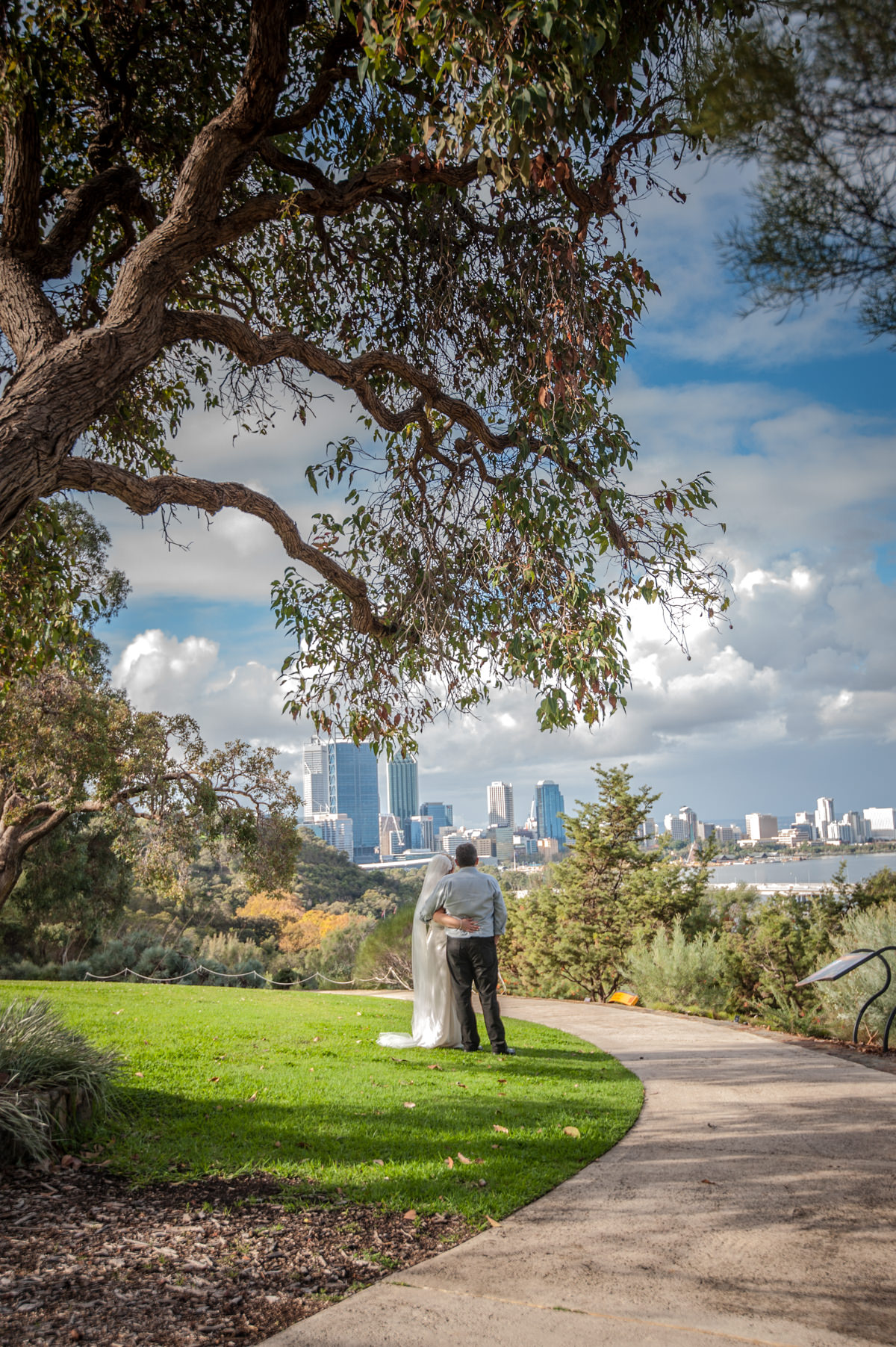 Bride and groom looking at the city at King's Park, Perth
