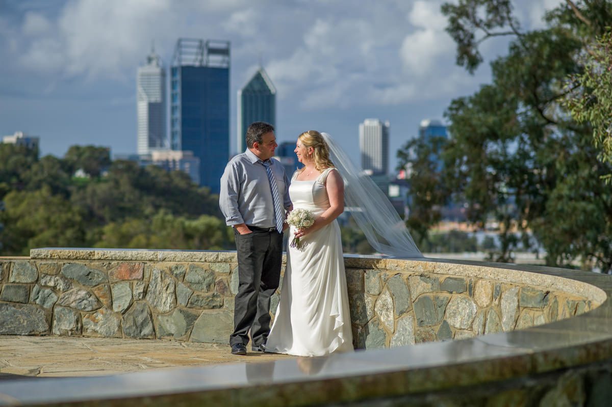 Bride and groom with Perth city in background