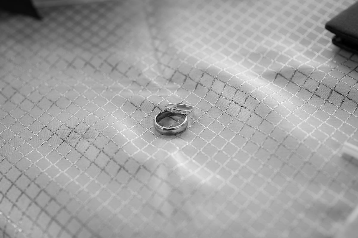 Black and white photo of wedding rings