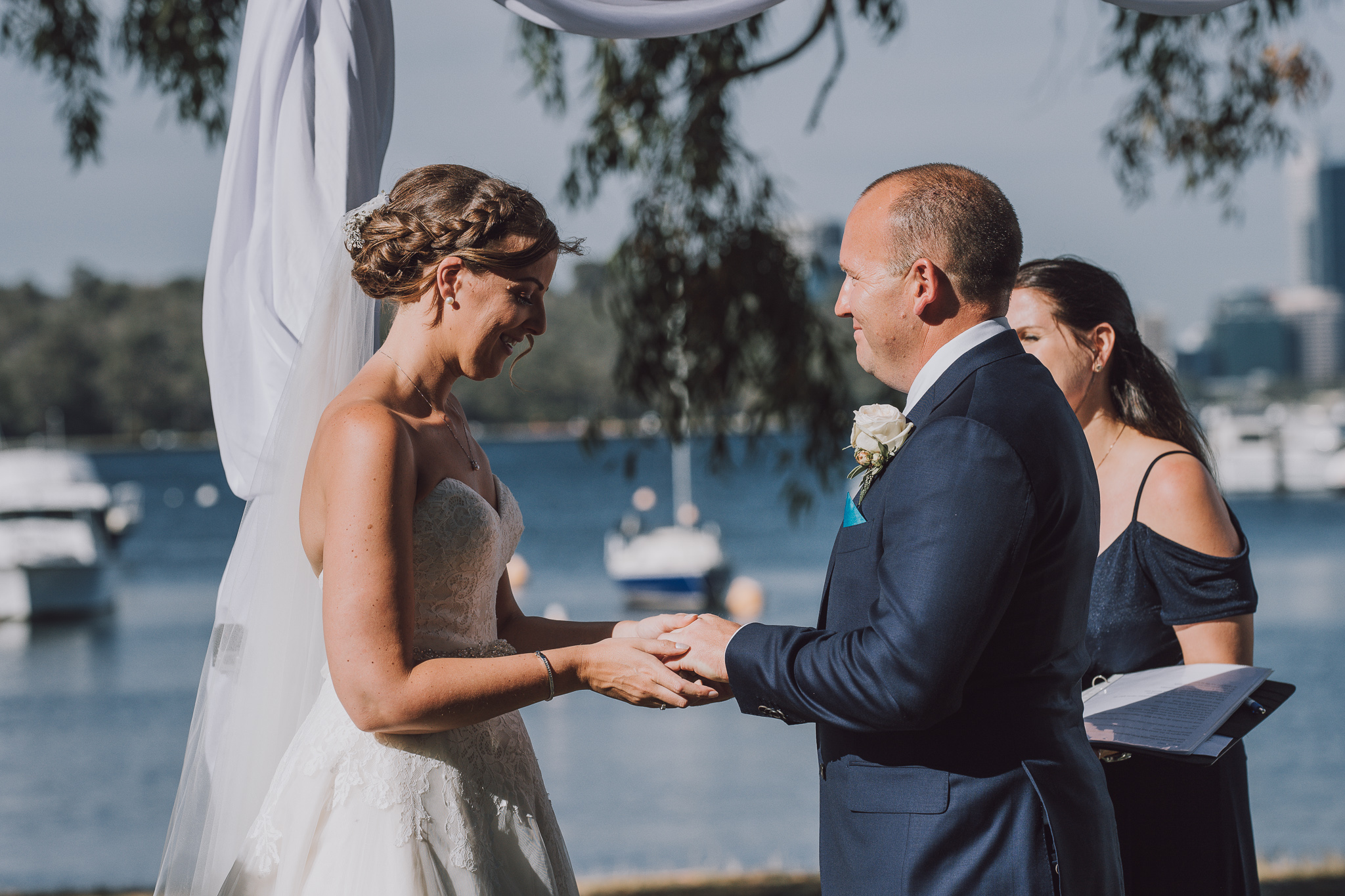 bride and groom holding hands