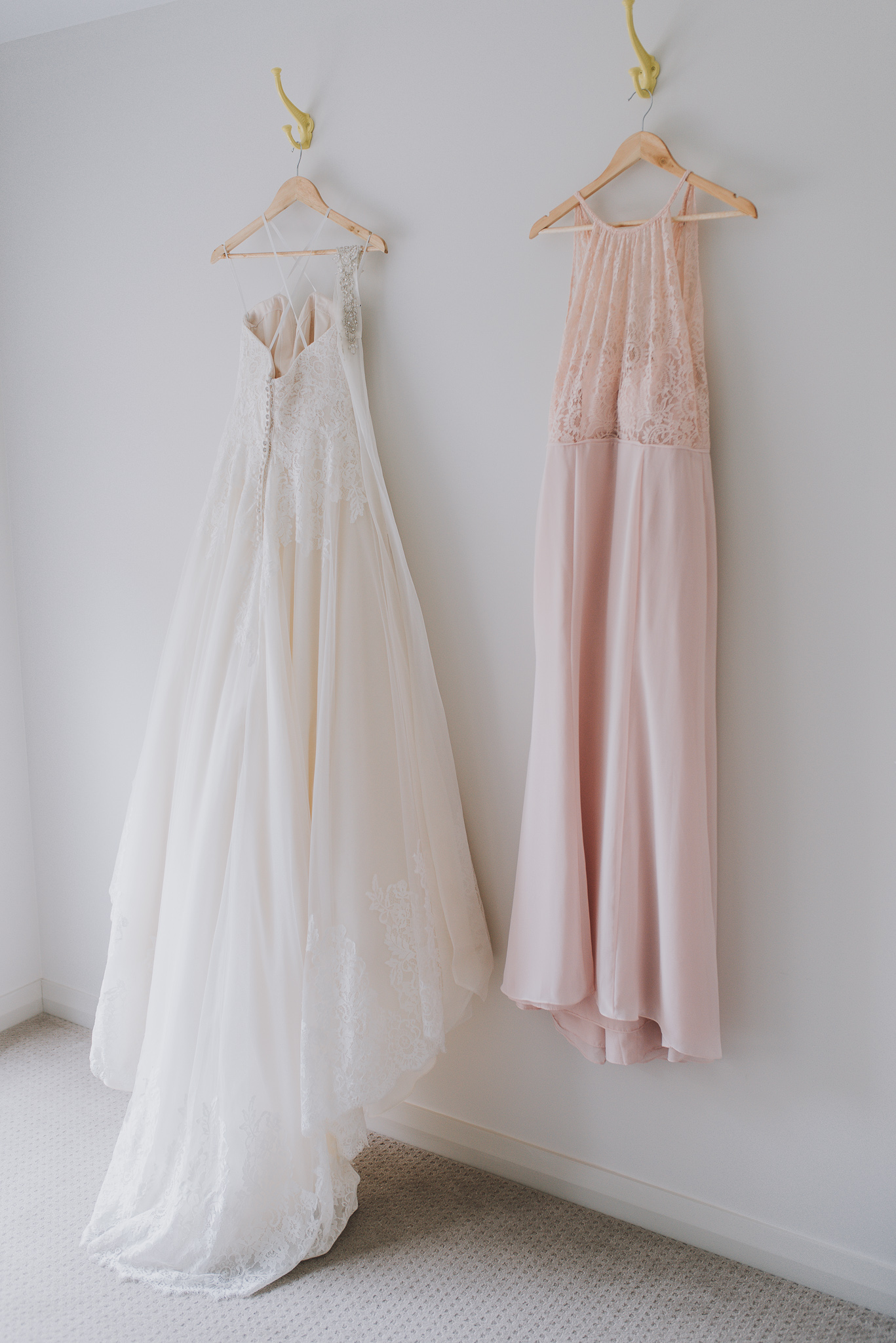 wedding dress and bridesmaid dress hanging