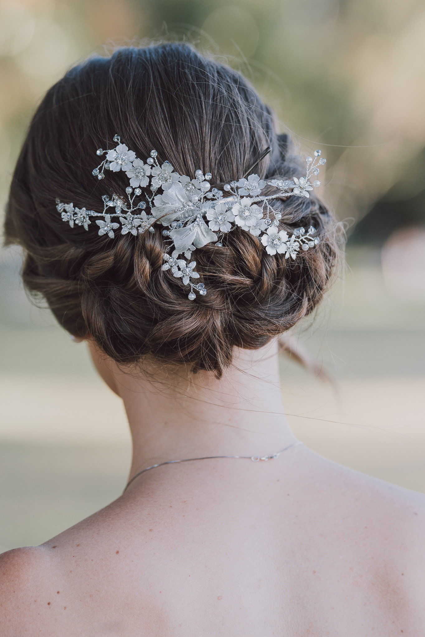 close up of back of brides hair comb