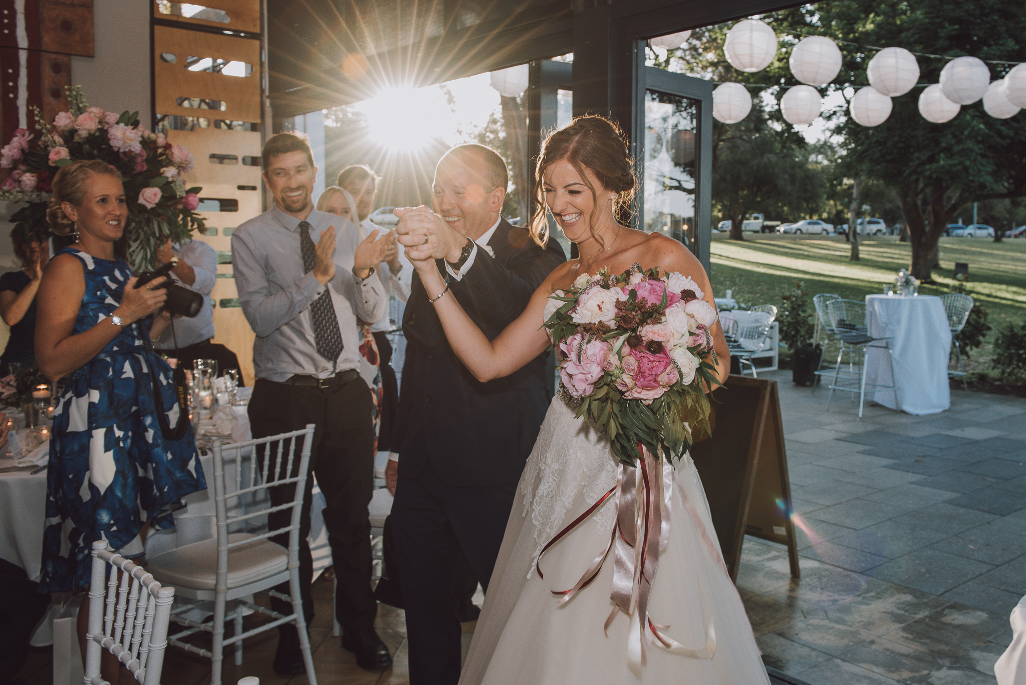 bride and groom entering their reception at Matilda Bay restaurant
