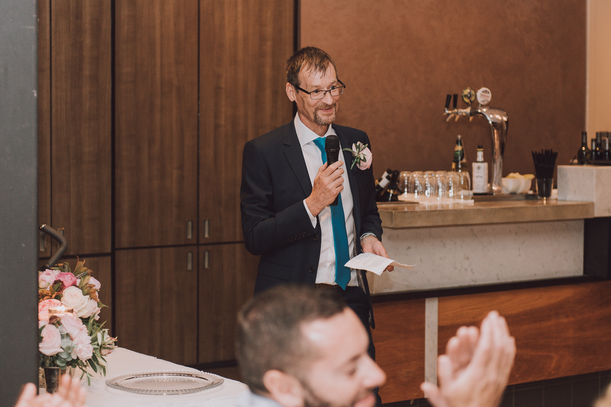 bride's father giving speech during reception