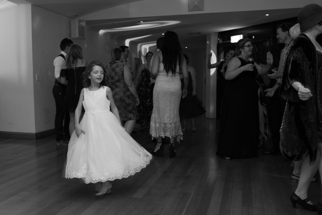 flower girl twirling on the dance floor