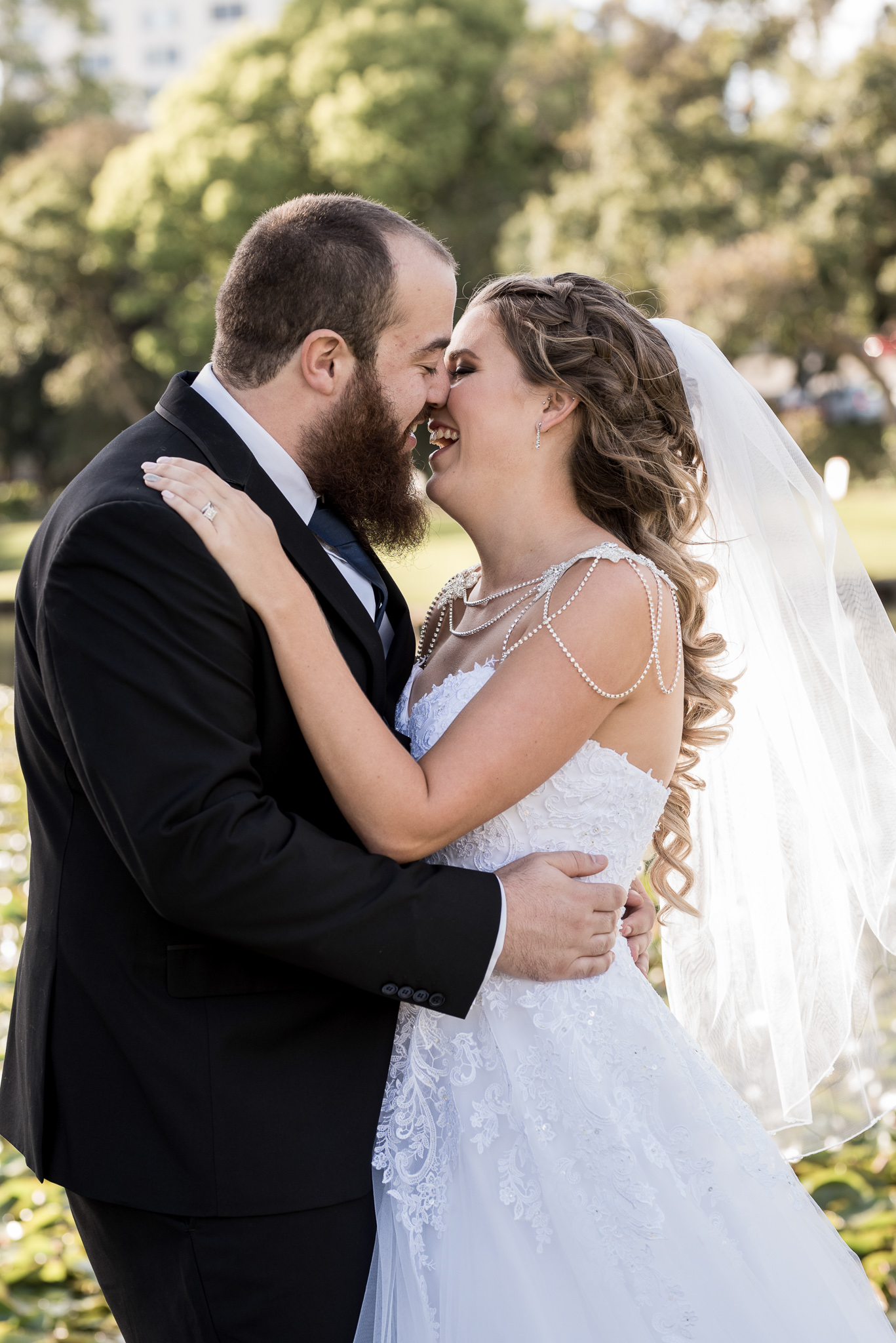 bride and groom about to kiss